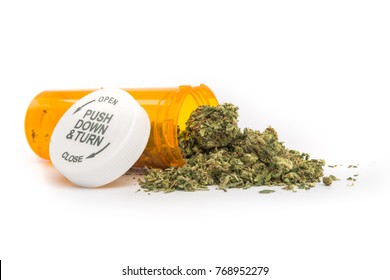 Close Up Of Medical Marijuana In Yellow Pill Bottle On White Background