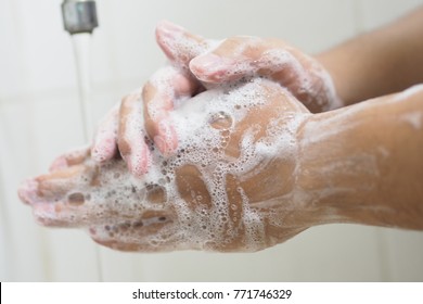 Close Up Of Medical Staff Washing Hands. Hand hygiene. 