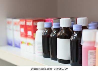 Close Up Medicine Bottles In The Pharmacy Shelves