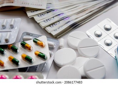 Close Up Of Medicine And Money Bank Notes. Money Making Big Pharma Concept.