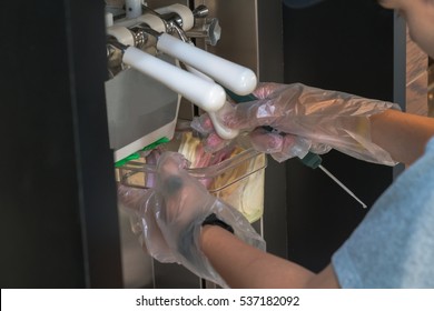 Close Up Of Men's Hand Holding Kitchen Thermometer And Measuring Ic Cream Temperature
