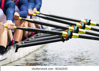 Close up of a men's quadruple skulls rowing team, seconds after the start of their race - Shutterstock ID 82162555