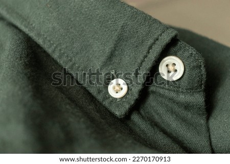 Close up of a mens shirts. Button On Shirt. Clothing background. Full frame