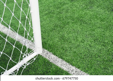 close up of mesh football goal with Artificial turf on  for sport background. - Powered by Shutterstock