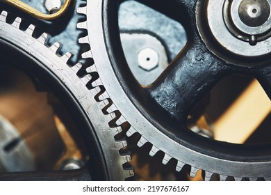 Close Up Of Metal Cog Wheel In Engine Of Machine.
