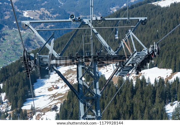 Close up metal tower of\
electric cable car or gondola on Alps mountain , Grindelwald \
Switzerland Europe