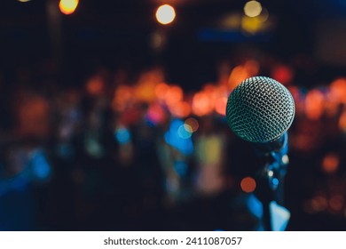 Close up of microphone in concert hall or conference room - Powered by Shutterstock