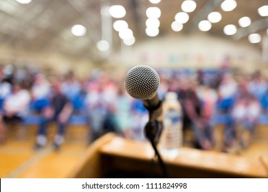 Close up of microphone on a podium in an auditorium - Shutterstock ID 1111824998