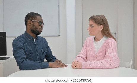 Close up of Middle Aged man Talking Woman in Meeting