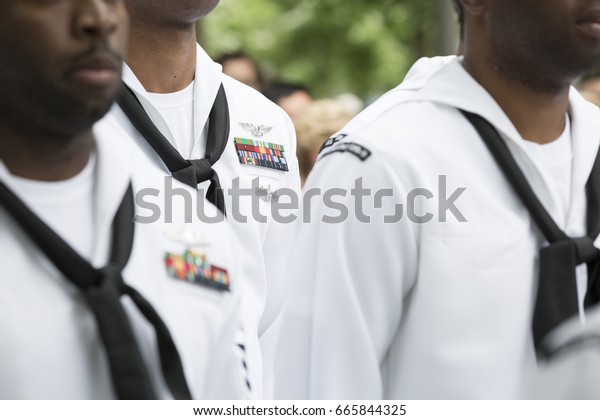Close up of military medals, ribbons, and neck
scarves worn by U.S. Navy personnel at the re-enlistment and
promotion ceremony on National September 11 Memorial site. Fleet
Week, NEW YORK MAY 26
2017
