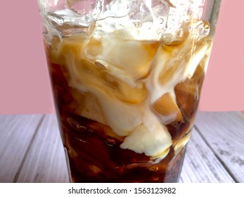 Close up of milk in iced coffee glass. - Powered by Shutterstock