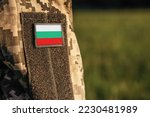 Close up millitary woman or man shoulder arm sleeve with Bulgaria flag patch. Bulgaria troops army, soldier camouflage uniform. Armed Forces, empty copy space for text

