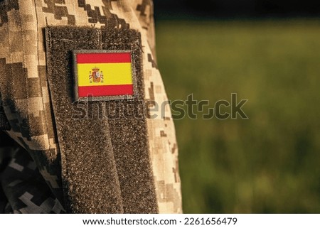Close up millitary woman or man shoulder arm sleeve with Ethiopia flag patch. Ethiopia troops army, soldier camouflage uniform. Armed Forces, empty copy space for text
