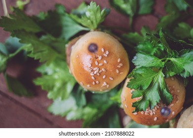 Close Up Of Mini Beef Burgers Isolated On Wood Background