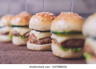 Close Up Of Mini Beef Burgers Isolated On Wood Background