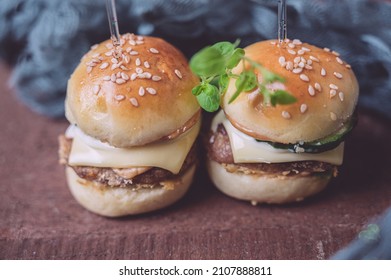 Close Up Of Mini Beef Burgers Isolated On Wood Background