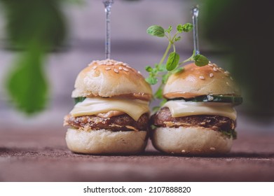 Close Up Of Mini Beef Burgers Isolated On Wood Background