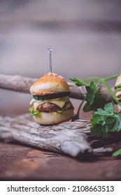 Close Up Of Mini Beef Burgers Isolated On Wood Background