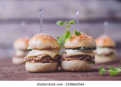 Close Up Of Mini Beef Burgers Isolated On Wood Background