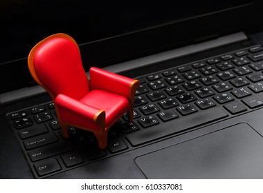 Close Up Mini Red Seat On Black Laptop Keyboard,Live Streaming Video Watching Concept,vip Seat.