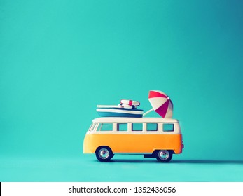 Close up miniature yellow car on blue background with copy space,summer vacation concept. - Powered by Shutterstock
