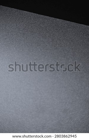 Close up of a minimalist black surface featuring smooth texture and clean geometric lines. Showcasing modern simplicity, architectural details, and elegant abstract composition, ideal for interior design, contemporary backgrounds, and creative layouts.