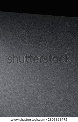 Close up of a minimalist black surface featuring smooth texture and clean geometric lines. Showcasing modern simplicity, architectural details, and elegant abstract composition, ideal for interior design, contemporary backgrounds, and creative layouts.
