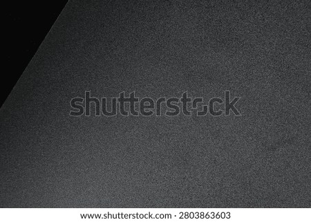 Close up of a minimalist black surface featuring smooth texture and clean geometric lines. Showcasing modern simplicity, architectural details, and elegant abstract composition, ideal for interior design, contemporary backgrounds, and creative layouts.