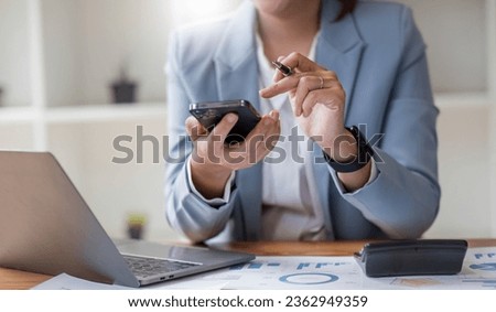 Close up mobile phone attractive Asian business woman using smartphone Space for text design online business woman working with mobile phone