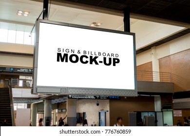 Close up the mock up and blank white screen billboard for advertising or information hanging near to escalator in airport terminal, with clipping path
