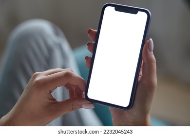 Close up Mock up white screen blank close up mobile phone in woman hands holding Back view - Powered by Shutterstock