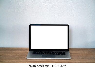 Close Up Mockup Laptop With Blank Screen On Wooden Desk. 