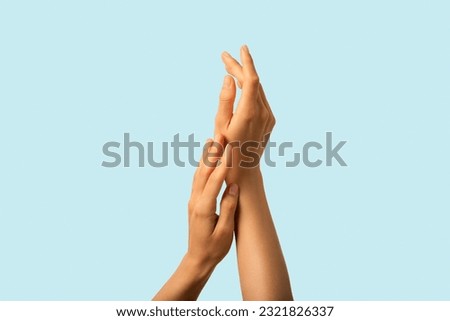 Close up model tender hands touching one another. Healthy moisturized skin