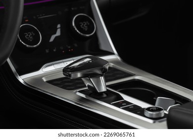 Close up of the modern automatic gearbox lever. Automatic transmission shift selector. Gear selector close up.