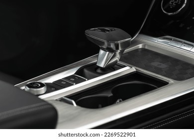 Close up of the modern automatic gearbox lever. Automatic transmission shift selector. Gear selector close up.