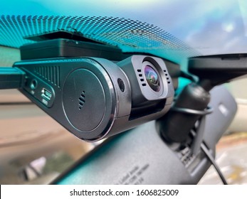 Close Up Of Modern Car Dashcam Attached To The Windshied Of The Car.