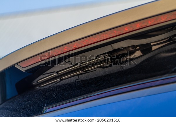 Close up\
of a modern car wiper. Modern car rear\
wiper.