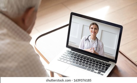 Close up of modern elderly man sit at home having online consultation with doctor on computer, sick senior male talk on video call consulting with female nurse using laptop, healthcare concept - Shutterstock ID 1639376185