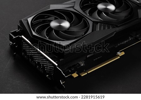 A close up of a modern GPU Graphic card on dark background