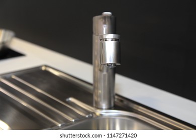 Close Up Of Modern Kitchen Faucet And Sin