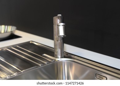 Close Up Of Modern Kitchen Faucet And Sin