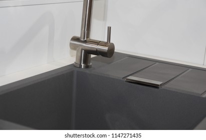 Close Up Of Modern Kitchen Faucet And Sin