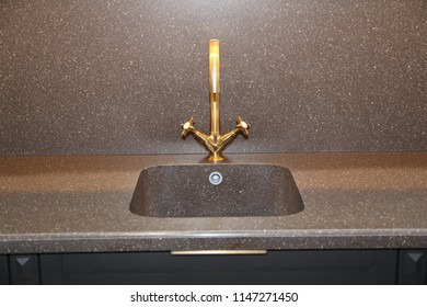 Close Up Of Modern Kitchen Faucet And Sin