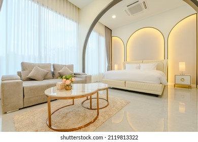 Close Up Modern Style Interior Design Of Double Bed  In Bedroom With Back Light On Wall.