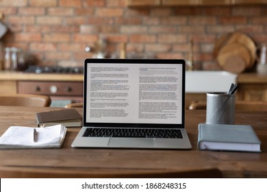 Close up modern technology gadget laptop with electronic documents standing on table, casual workplace of freelancer, distant worker or student home office, quarantine online working lifestyle. - Shutterstock ID 1868248315
