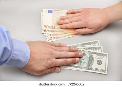 close up a money changing hands of people at bank