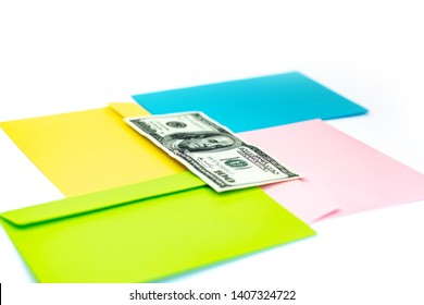 Close Up Of Money In Pink Envelope Are Lying On The Multi Colored Envelopes And Letters As A Background.  Branding Mock Up; Different Colored Envelopes On The Table. 