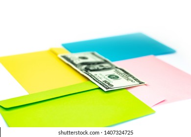 Close Up Of Money In Pink Envelope Are Lying On The Multi Colored Envelopes And Letters As A Background.  Branding Mock Up; Different Colored Envelopes On The Table. 