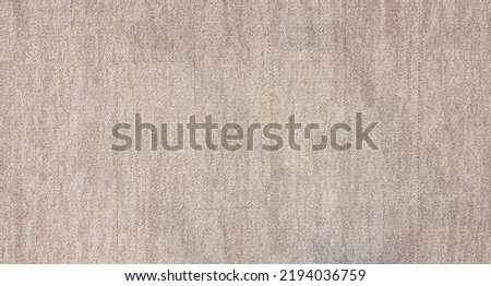 close up of monochrome beige or brown carpet texture background from above. texture tight weave carpet. the light color background of the carpet.