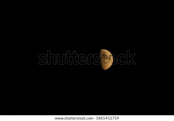 Close up of the moon first\
quarter